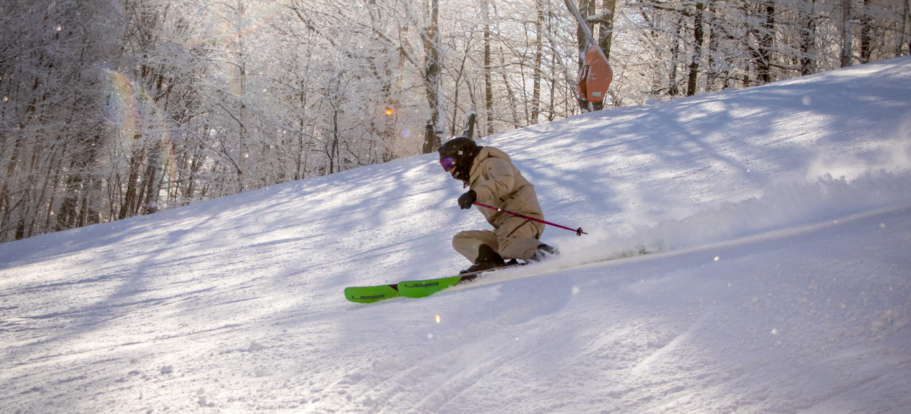 2022 Elan Ripstick 106 Black Edition Ski Review: Full Width Action Image 2